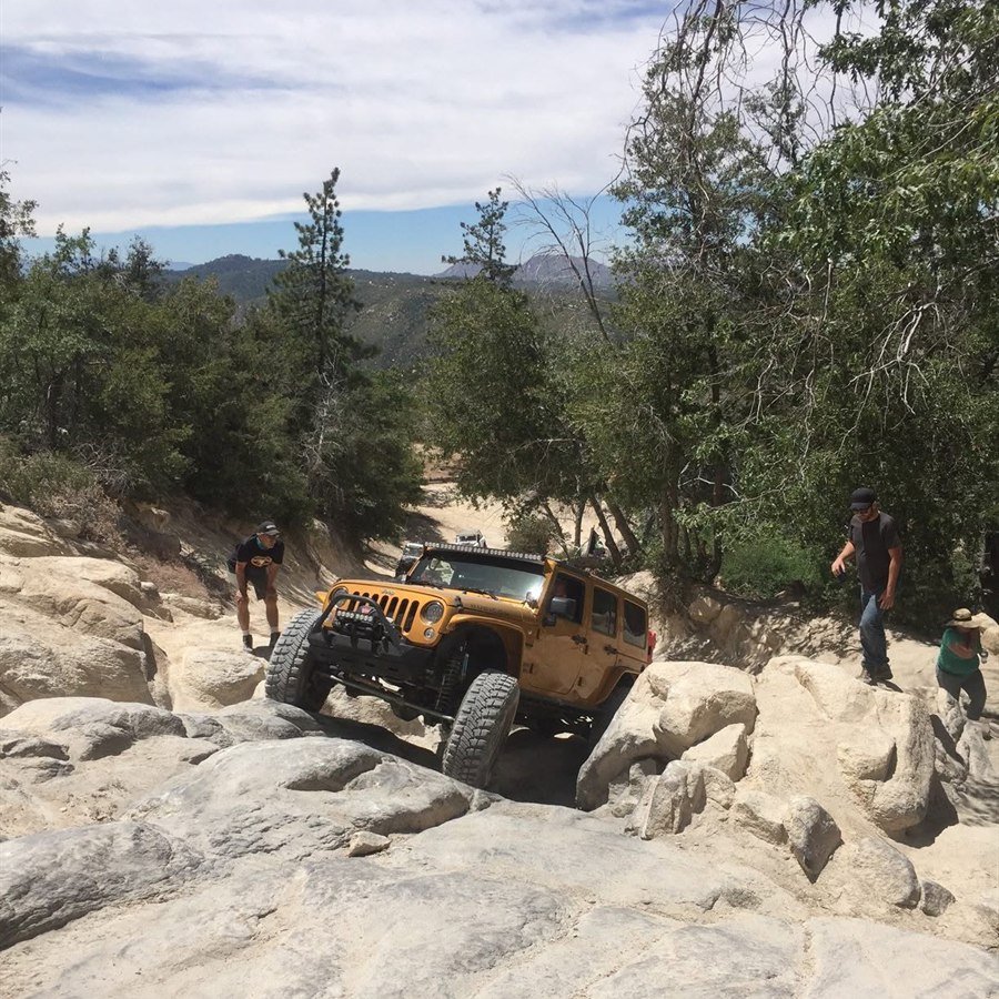 Climbing a rocky trail section
